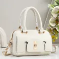 White PU leather shoulder handbag with gold hardware, elegant commuting crossbody bag design. - Off White