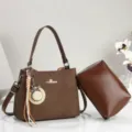 Brown herringbone shoulder handbag with matching pouch, charm and large capacity design. - Coffee