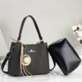 Black chevron pattern shoulder bag with clutch and straw hat charm for daily commuting. - Black