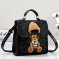 Stylish black PU leather backpack handbag featuring a cute knit bear patch and beanie design. - Black