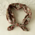 Detail view of Christmas knotted hairband, featuring festive red green stripe snowflake print. - Red And Green Striped Snowflake Style (No. 2) / 1 Piece