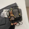 Preppy style canvas backpack with cute rabbit pendant, retro commuter casual school bag. - With Pendant / Black