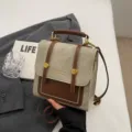 Vintage canvas college style mini backpack handbag in beige and brown with metal lock and handle. - No Pendant / Beige And Brown