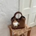 Brown suede patchwork shoulder bag for women, stylish commuting handbag with cute keychain. - With Pendant / Brown