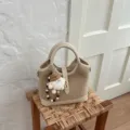 Korean style minimalist beige bucket bag crossbody shoulder bag for daily commute. - With Pendant / Off White