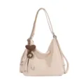 Convertible hobo shoulder bag and backpack in beige with stylish knit heart pendant charm. - Beige With Pendant