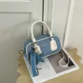 Denim Boston handbag detail view, white leather trim and cute star charm for daily wear. - With Star Pearl Pendant Style / White