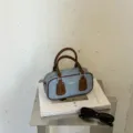Vintage denim Boston handbag with brown leather trim, stylish shoulder and crossbody bag. - Without Charm Style / Coffee