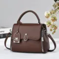 Brown textured leather structured handbag with top handle and crossbody strap for daily use. - Coffee