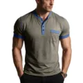 Close-up detail of men's short sleeve Henley t-shirt with contrast blue trim and pocket. - S / Tops / Khaki