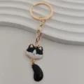 Cute black and white cat metal keychain with dangled tail, gold ring for bag key pendant. - Black and White Cat Style (1)