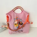 Roze stoffen shopper schoudertas met geborduurde bloemen, touw handvatten en casual design. - Groot Zonder Band / Roze Bloemen Kader
