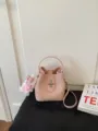 Pink lychee pattern bucket bag women stylish shoulder handbag with metal lock and charm. - With Charm / Pink