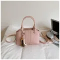 Pink PU leather handbag with beaded pendant, stylish commute tote and crossbody bag. - With Pendant / Pink