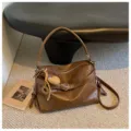 Brown oil wax leather shoulder bag for women, retro casual commuter crossbody bag with heart pendant. - Khaki With Pendant