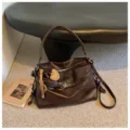 Brown oil wax leather shoulder bag, stylish commuter crossbody bag with decorative charms for women. - Coffee with Charm