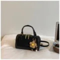 Black fashion pillow handbag with shoulder strap and cute flower charm, chic commuter bag. - With Pendant / Black