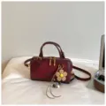 Burgundy boston handbag for women, vintage style pillow shoulder bag with cute flower pendant. - With Pendant / Red