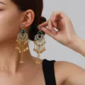 Detailed view of bohemian vintage rhinestone hollow petal tassel earrings with green crystal. - Petal Tassel Style (weh6388) / Green Antique Gold