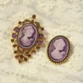 Vintage cameo brooch set featuring elegant purple portrait design with gold tone filigree. - Gold-Purple