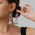 Close-up detail of vintage silver drop earrings with red square crystal and bell tassels. - Square Rhinestone Tassel Style (weh6384) / Red Antique Silver