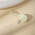 Cute Pipa shape hair clip with pearls and green enamel floral decor for sweet girls. - Epoxy Flower Tassel Pipa Hair Clip (X1142-3)