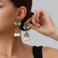 Detailed close-up of vintage ethnic jhumka earrings featuring gold tone, green stone, and pearls. - Pearl Tassel Style (weh6386) / Green Antique Gold