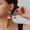 Close-up detail of retro gold dangle earrings with black stone, small pearls and bell charms. - Pearl Tassel Style (weh6386) / Black Antique Gold