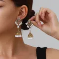 Close-up detail showing intricate gold filigree design and hanging pearls of the vintage earrings. - Pearl Bell Style (weh6383) / Pink Antique Gold