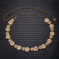 Gold metal chain belt with floral charms, detailed view showing elegant design for dresses. - Flower Style / Gold