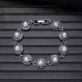 Vintage silver pearl bracelet detail shot, elegant round design with intricate metal craftsmanship. - Vintage Style L740-4