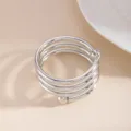 Close-up detail view of the modern silver multi-turn alloy napkin ring for table decor. - Spiral Bead (X1132-1) / Silver