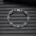 Close-up of vintage turquoise silver bracelet, intricate carved details, ethnic jewelry style. - Vintage Style L740-10