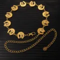 Detailed shot of retro gold metal waist chain with horseshoe and cowboy boot link charms. - X1205 (Gold)