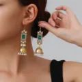 Detail shot of vintage gold ethnic jhumka earrings featuring green crystal, rhinestones, and pearls. - Square Rhinestone Tassel Style (weh6384) / Green Antique Gold