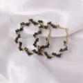 Detailed close-up of fashion European style wrapped crystal hoop earrings with black beads for women. - Regular Style (ES3656) / Black Rhinestone Embellished