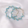 Detail view of trendy blue crystal wrapped gold hoop earrings for stylish women daily wear. - Regular Style (ES3661) / Blue Rhinestone Embellished Style