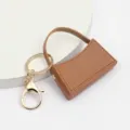 Mini sac à main porte-clés vue détaillée, charmant accessoire de sac en cuir PU élégant. - Marron