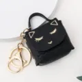 Détail de porte-clés sac à main chat noir mignon en cuir PU, charmant et élégant. - Noir