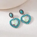 Bohemian retro turquoise heart earrings with sparkling crystal and vintage silver finish detail. - Blue