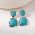 Bohemian turquoise drop earrings, vintage silver detailed double stone drop detail design closeup - Blue