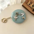 Lichtgroene ronde opvouwbare make-up spiegel sleutelhanger met schattig ballerina design. - Blauw