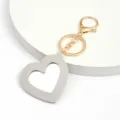 Porte-clés miroir en cuir PU en forme de cœur avec quincaillerie dorée, accessoire de poche. - Gris