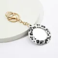 Porte-clés miroir de maquillage rond portable avec pendentif de sac en cuir PU imprimé léopard. - Miroir Rond Imprimé Léopard Noir et Blanc