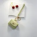 Mini sac de rangement pour écouteurs en cuir porte-clés avec dragonne et fermoir doré chic. - Vert