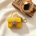 Mini gele krokodillenpatroon sleutelhanger tas, leuke oortelefoon etui met slot. - Geel