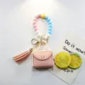 Porte-clés en perles de silicone avec mini porte-monnaie en cuir et pendentif gland. - Bracelet avec Goutte / Rose