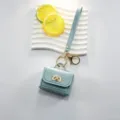 Mini sac en cuir avec fermoir tournant porte-clés joli charm pour sac et écouteurs - Bleu