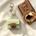 Mini handtas sleutelhanger, lichtgroene krokodillenstructuur PU leer, leuke oordopjes tas. - Lichtgroen
