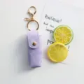 Portachiavi con custodia per rossetto in denim viola, mini borsa in pelle con gancio. - Viola